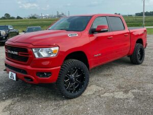 Red Dodge Ram with new wheels