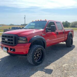 Red truck with new wheels