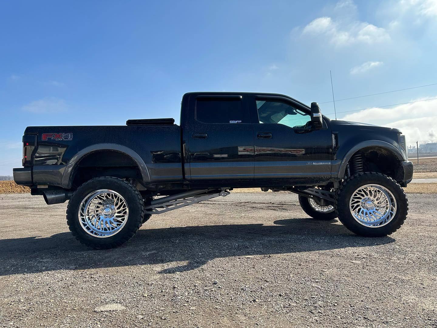 Black truck with new wheels